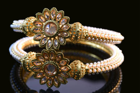 Gold bracelet with stones